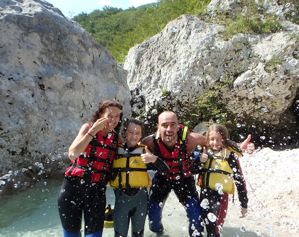 Family rafting in Bovec | Family is enjoying active time togather on rafting tour