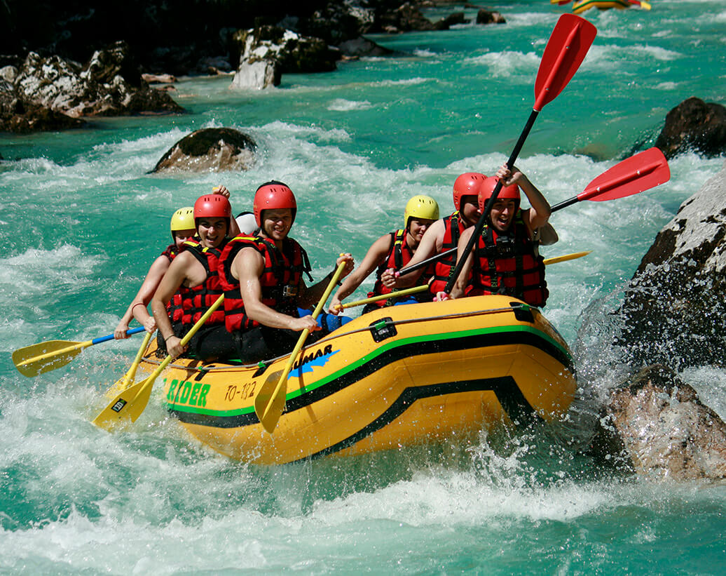 Spashy rapids of Soča river | Rafters are enjoying the rafting tour with Soca Rider - Rafting Slovenia