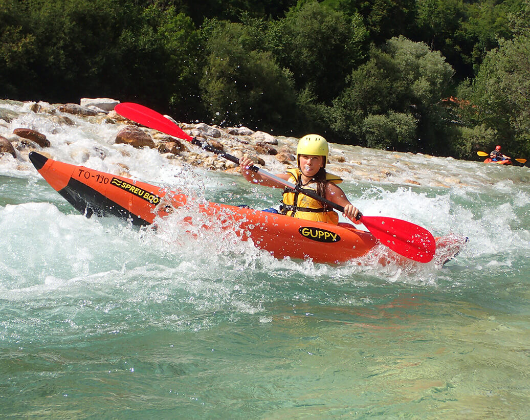 Whitewater kayak tour on Soča river is also suitable for kids from the age of ten.