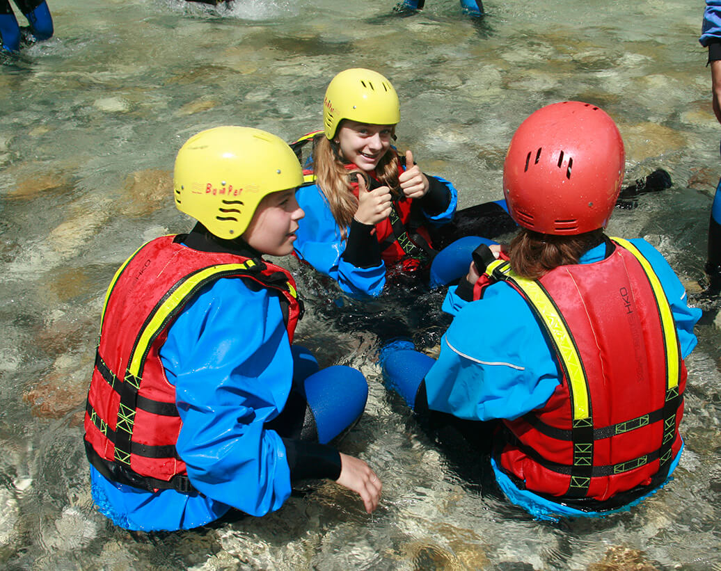 School group is enjoying rafting in Bovec, Slovenia